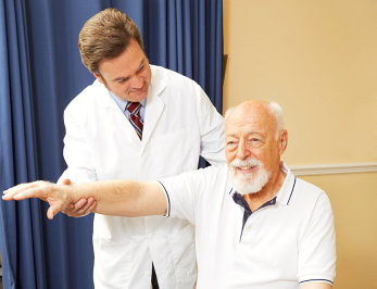 old man having a physical test